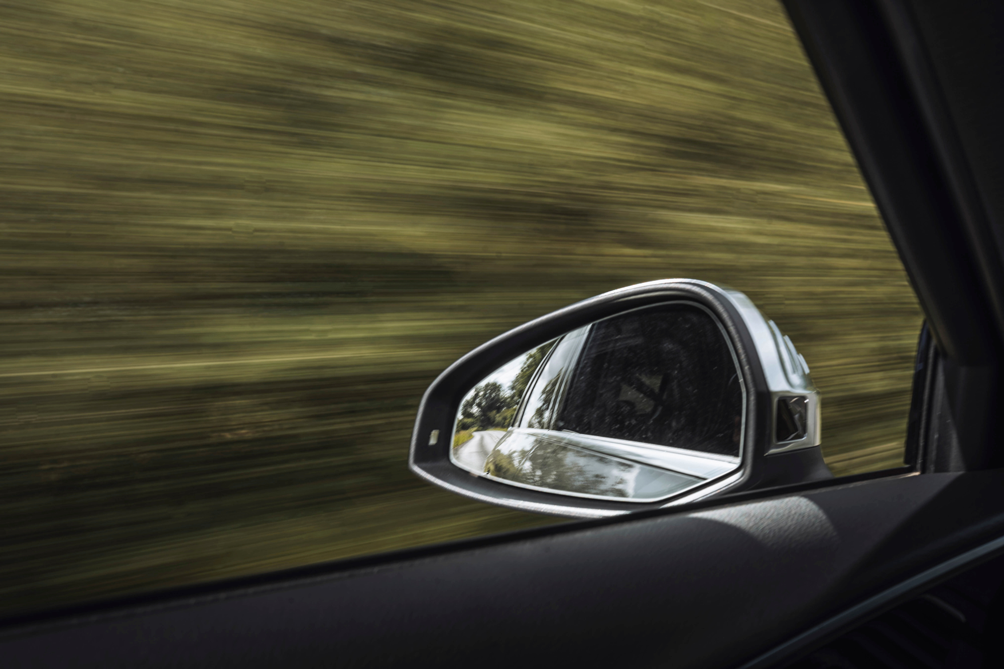 Image of a car with a blurred background from speed