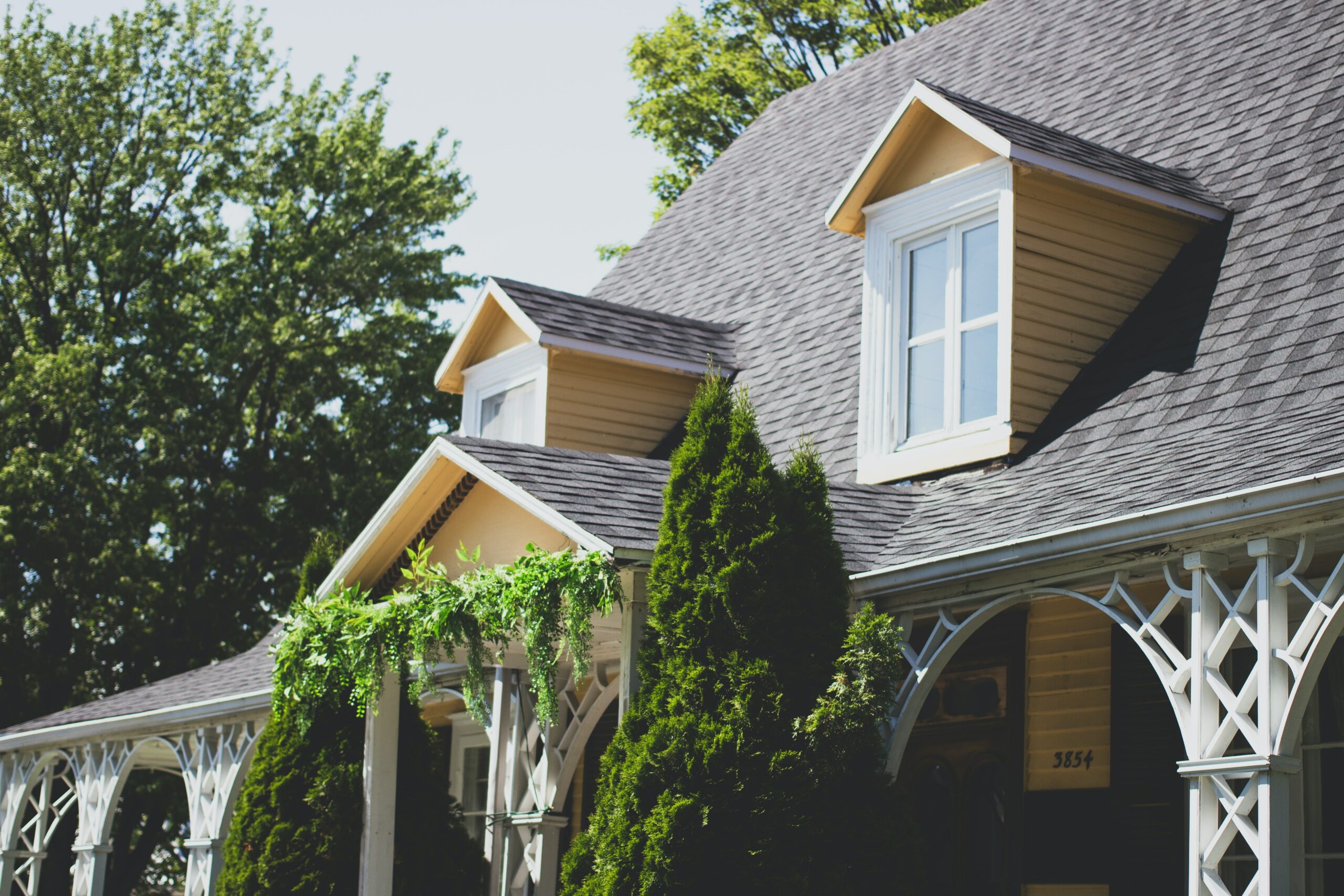 front of a yellow house